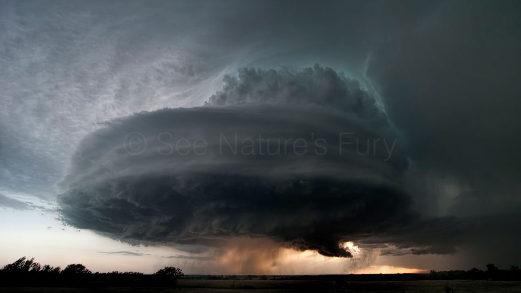A well established supercell with green hints of colour from hail in Kansas. This was shot during a storm chasing, weather and photography tour.