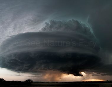 A well established supercell with green hints of colour from hail in Kansas. This was shot during a storm chasing, weather and photography tour.