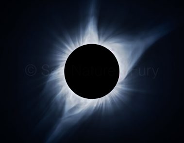 Total solar eclipse of the sun. Solar flares are clearly visible. This was shot during a storm chasing, weather and photography tour.